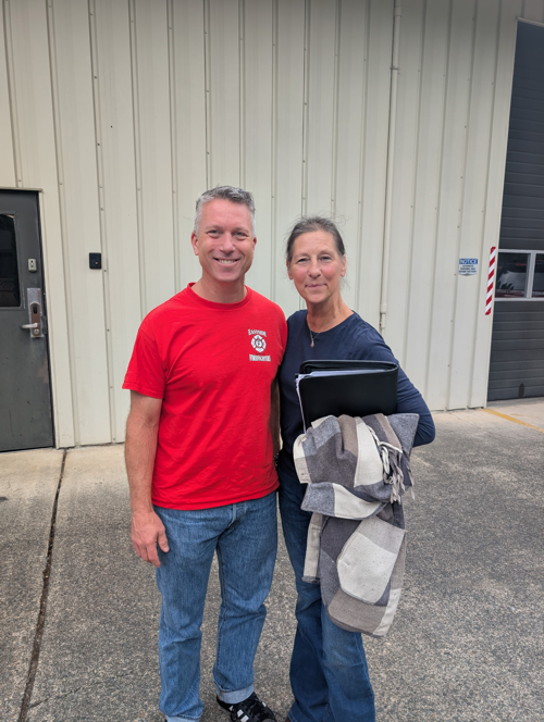 Ray Austin standing beside a man wearing an IAFF Local 1762 jacket
